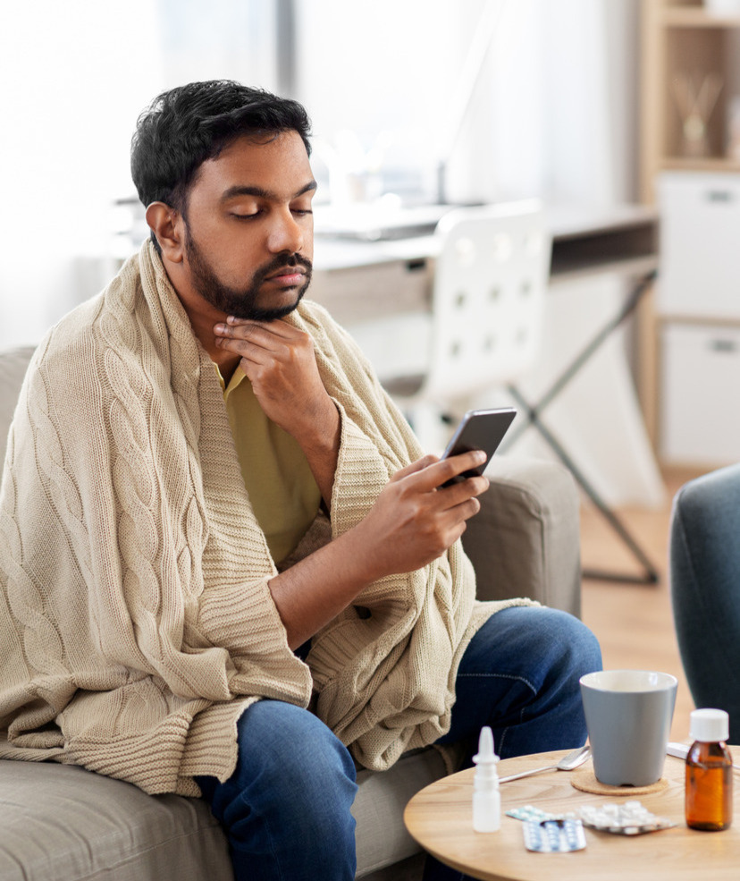 Photo of a man at home with a cold