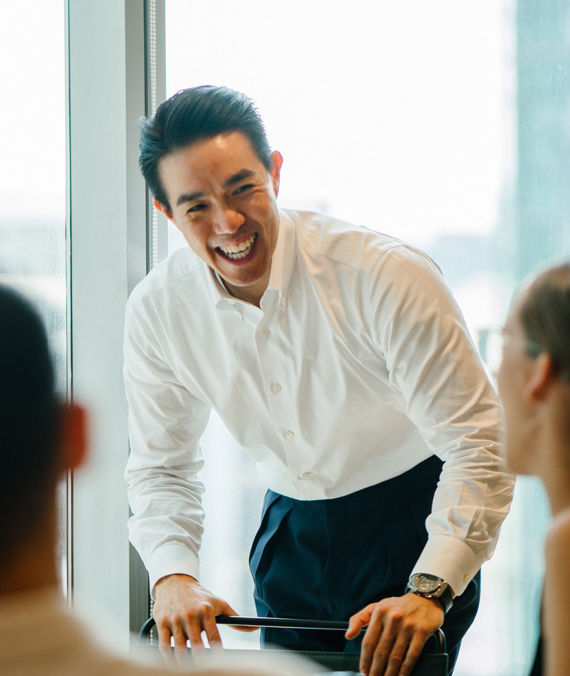 Photo of a man at work in a conference room